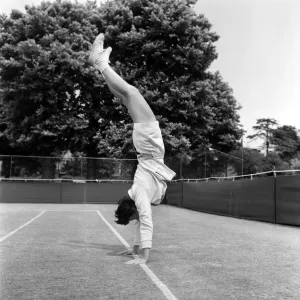 Lawn Tennis at Beckenham. Woman training before a match at the club June Lawn Tennis at Beckenham. Woman training before a match at the club June
