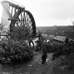 The Laxey Wheel in the village of Laxey, Isle of Man. May 1954