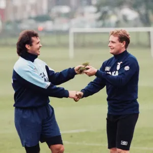 Lazio footballer Paul Gascoigne is handed a piece of turf by teammate Roberto Cravero