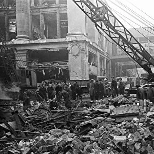 LCC and Civil Defence workers seen here clearing up following a V2 explosion at the Red