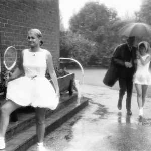 Lea Pericoli v Susanna Alexander at the rain soaked pre Wimbledon garden party Lea Pericoli v Susanna Alexander at the rain soaked pre Wimbledon garden party