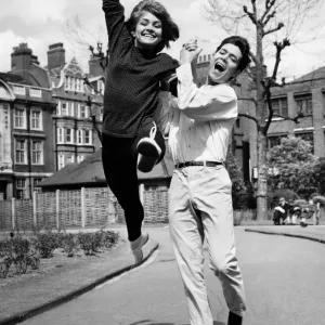 Leading Cliff a dance! Girl leading Cliff Richard in a light-hearted Leading Cliff a dance! Girl leading Cliff Richard in a light-hearted