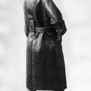 Leather Rainwear September 1965 Model wearing black Leather coat and hat Leather Rainwear September 1965 Model wearing black Leather coat and hat