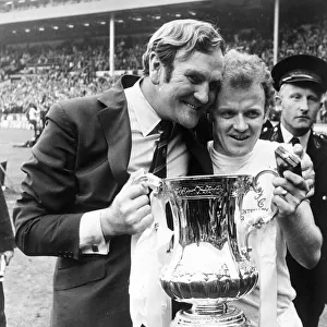 Leeds manager Don Revie with captain Billy Bremner hold the FA Cup trophy following their