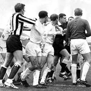 Leeds player Jack Charlton in the middle of this sskirmish in a game against Newcastle
