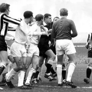 Leeds player Jack Charlton in the middle of this sskirmish in a game against Newcastle Leeds player Jack Charlton in the middle of this sskirmish in a game against Newcastle
