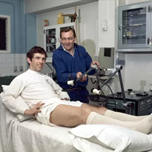 Leeds United footballer Johnny Giles receives tretment on an injury in the physio room
