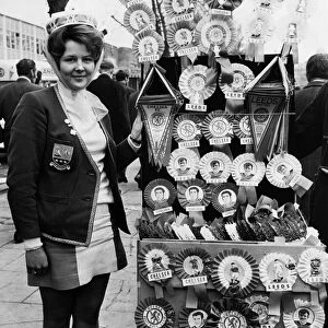 Leeds United supporter Mrs Barbra Pewte seen here standing beside a rosette stall outside