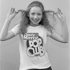 Lena Zavaroni wears a Daily Mirror Pop Club T-Shirt. 5th May 1976
