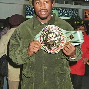 Lennox Lewis Boxing arriving at Heathrow from Las Vegas with his WBC championship belt