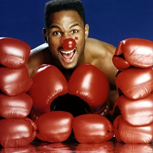 Lennox Lewis Heavyweight Boxer poses for Red Nose Day. March 1991