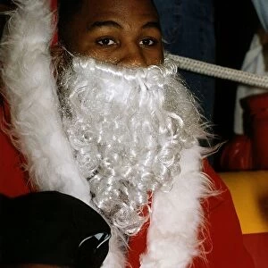 Lennox Lewis WBC World Boxing heavyweight champion at Sky TV dressed up as Santa Claus