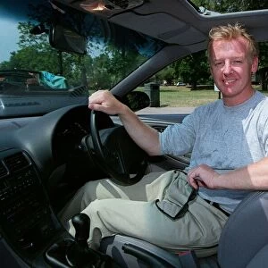 Les Dennis Comedian / TV Presenter December 97 Sitting in the driving seat of the new