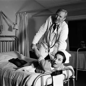 Leslie Phillips and Shirley Anne Field on the set of Doctor in Clover Leslie Phillips and Shirley Anne Field on the set of Doctor in Clover