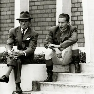Lester Piggott sits outside the weighing-in room, chatting with friends Lester Piggott sits outside the weighing-in room, chatting with friends