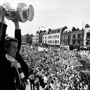 Liam Brady of Arsenal holding up trophy for crowds in Highbury, North London