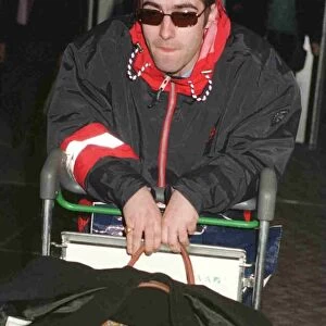 Liam Gallagher of the pop group Oasis arriving at Heathrow from Paris