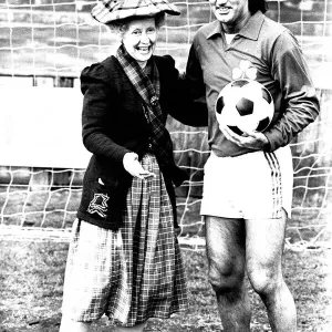 Lib - Football legend George Best giving actress Gudrun Ure some footballing tips during