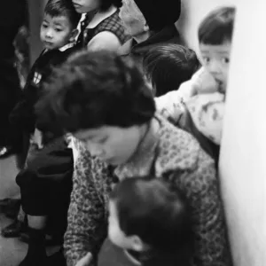 Print of a crowded clinic in 1960s Hong Kong