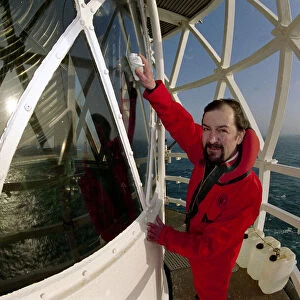 Lighthouse keeper Colin Jones seen here clearing the light during this last relief tour
