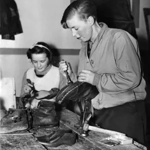 Lincoln Camp School. One of the females staff of the Lincoln Camp School repairing her Lincoln Camp School. One of the females staff of the Lincoln Camp School repairing her