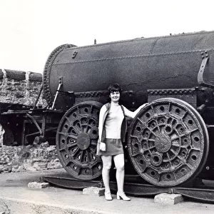 Linda Iley beside Braddyll on 6th May 1973, an old engine that once served as a snow plow