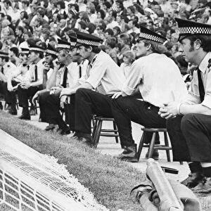 A line of policemen and women control the Newcastle United fans at St James Park 21