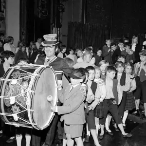 Lionel Bart who wrote Oliver'plays the big drum from the Irish Guards as he