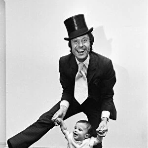 Lionel Blair giving dancing tuition to his 10-month-old son Daniel. 23rd June 1969