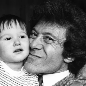 Lionel Blair pictured at home with his son. 19th October 1983