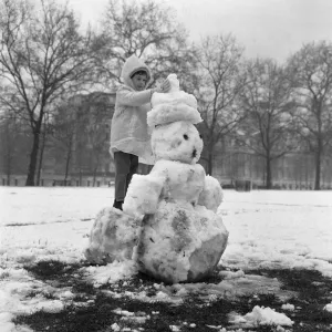 A Little Girl Crowns Her Snowman Print, St James Park, London 1961