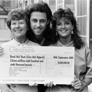 Live Aid fundraising star Bob Geldof was presented with a giant National Girobank cheque Live Aid fundraising star Bob Geldof was presented with a giant National Girobank cheque