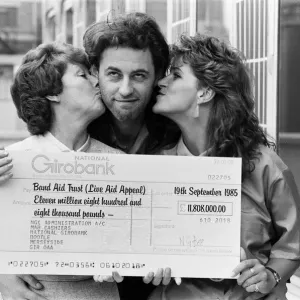 Live Aid fundraising star Bob Geldof was presented with a giant National Girobank cheque Live Aid fundraising star Bob Geldof was presented with a giant National Girobank cheque