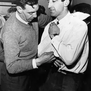 Liverpool assistant trainer Joe Fagan puts the injured right shoulder of Gerry Byrne in a Liverpool assistant trainer Joe Fagan puts the injured right shoulder of Gerry Byrne in a