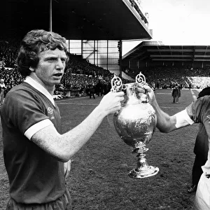Liverpool captain Emlyn Hughes and David Fairclough celebrate with the League