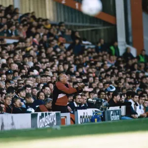 Liverpool coach Ronnie Moran shouting out instructions from the dugout during a Premier Liverpool coach Ronnie Moran shouting out instructions from the dugout during a Premier
