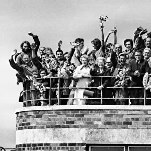 Liverpool fans gathered on the balcony at Speke Airport as their idols board their plane