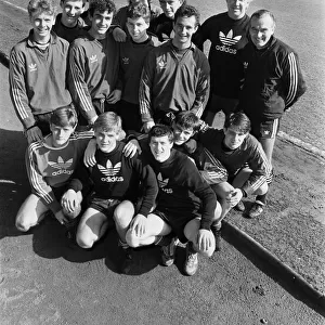 Liverpool Football Club youth squad pose at Anfield with their coaches Chris Lawler