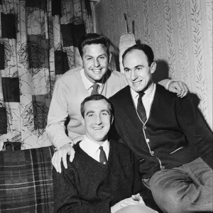 Black and white print of Jimmy Melia with teammates