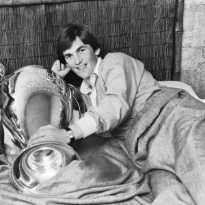 Liverpool's Kenny Dalglish with European Cup trophy in bed, Print Liverpool's Kenny Dalglish with European Cup trophy in bed, Print