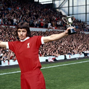Liverpool footballer Kevin Keegan shows off his Best Youngster of the Year Award before a