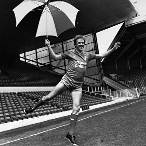 Liverpool footballer Phil Neal models the new Liverpool kit at Anfield