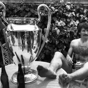 Liverpool footballer Tonny Smith enjoys a bottle of beer as he sits with the famous Liverpool footballer Tonny Smith enjoys a bottle of beer as he sits with the famous