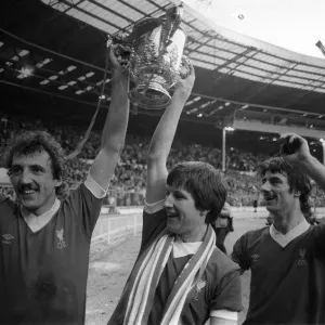 Liverpool footballers Alan Kennedy and Ronnie Whelan hold the League Cup trophy aloft Liverpool footballers Alan Kennedy and Ronnie Whelan hold the League Cup trophy aloft