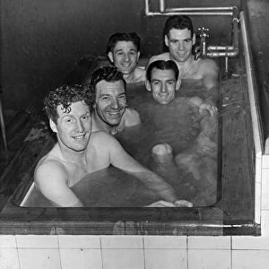 Liverpool footballers in the bath after a match, shortly before their appearance inn