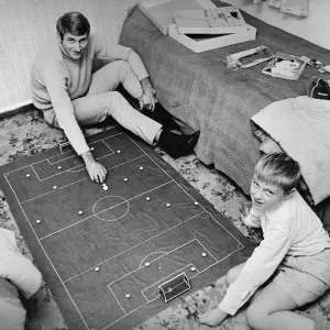 Liverpool forward Roger Hunt at home playing subbuteo with his son Liverpool forward Roger Hunt at home playing subbuteo with his son