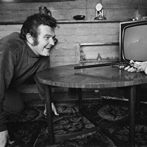 Liverpool goalkeeper Tommy Lawrence playing with his young son Stephen aged two