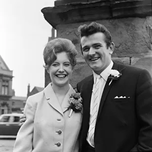 Liverpool goalkeeper Tommy Lawrence poses with his 19 year old bride Judith price after