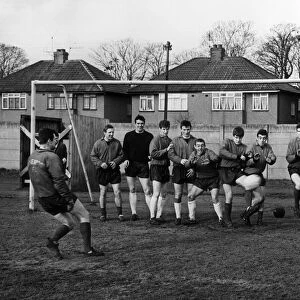 Liverpool Goalkeeper Tommy Lawrence takes a pot shot at the rest of the team