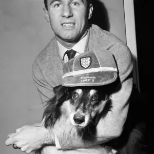 Liverpool inside forward Jimmy Melia celebrates with pet collie dog Sheena at his Liverpool inside forward Jimmy Melia celebrates with pet collie dog Sheena at his